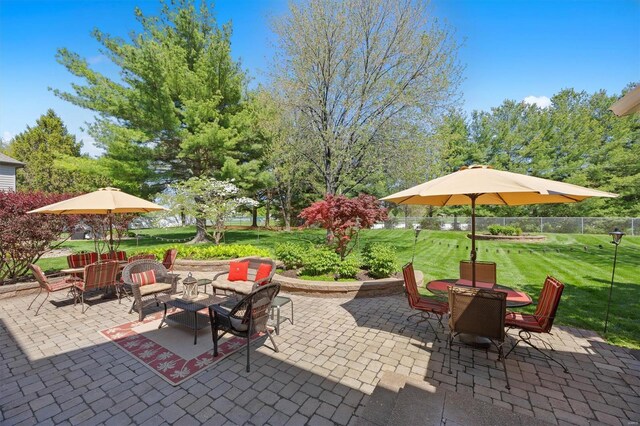 view of patio / terrace featuring fence and outdoor dining area