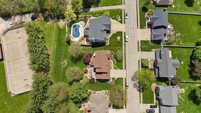 birds eye view of property with a residential view