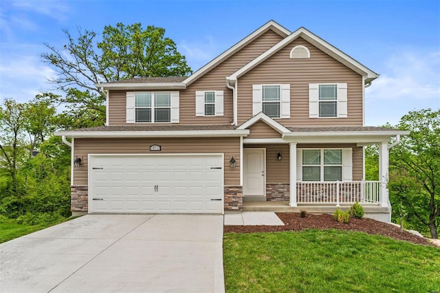 view of front facade with stone siding, a garage, a front lawn, a porch, and driveway