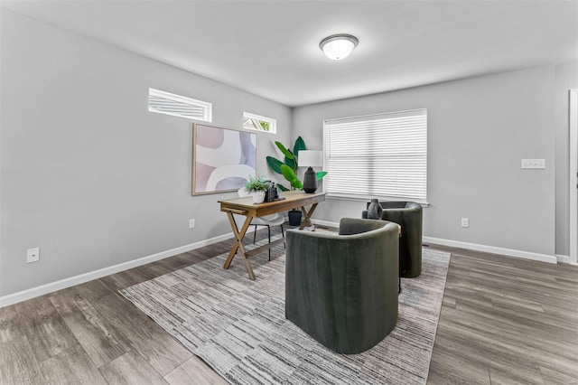 home office with wood finished floors and baseboards