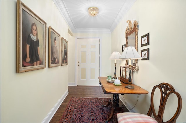 hallway with baseboards, dark wood finished floors, and ornamental molding