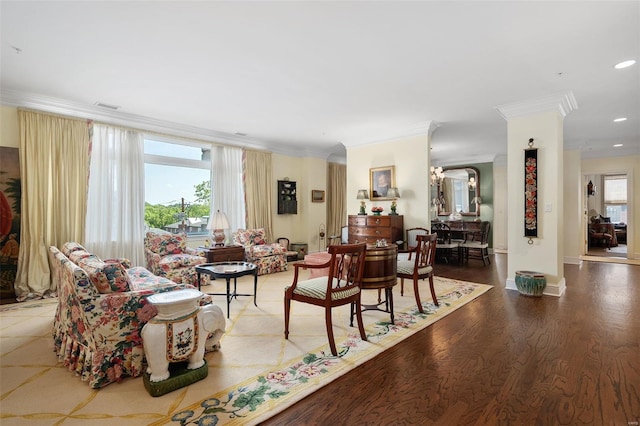 living room featuring visible vents, crown molding, wood finished floors, baseboards, and recessed lighting