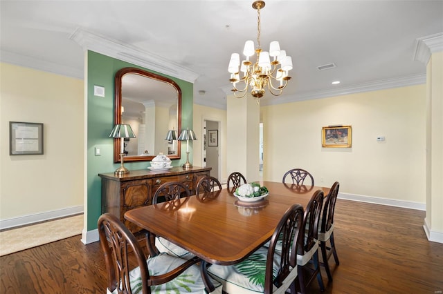 dining area featuring crown molding, baseboards, wood finished floors, and an inviting chandelier