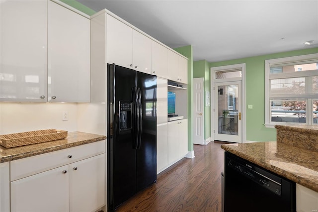 kitchen featuring dark wood-style flooring, stone counters, black appliances, and white cabinetry