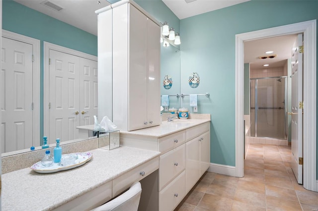 full bathroom with visible vents, tile patterned flooring, vanity, baseboards, and a stall shower