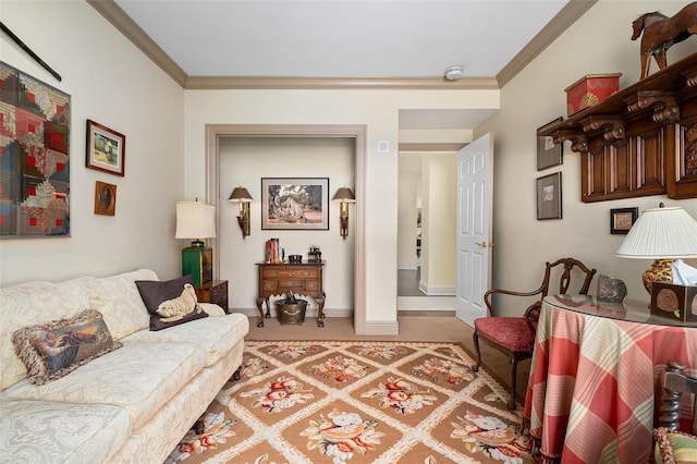 living area with baseboards, ornamental molding, and light carpet