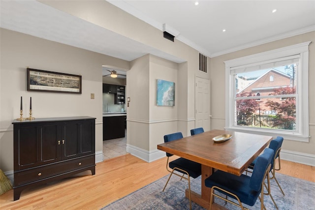 dining space featuring recessed lighting, baseboards, light wood-type flooring, visible vents, and ornamental molding