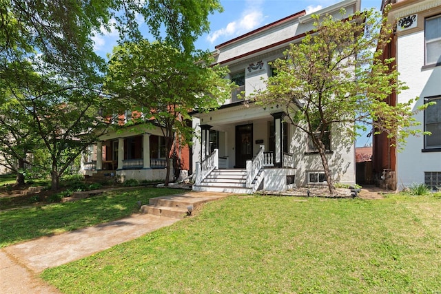 view of front facade featuring covered porch and a front lawn