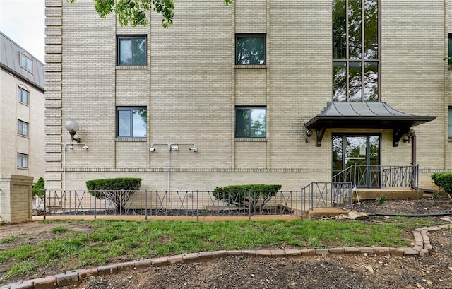 view of building exterior with fence