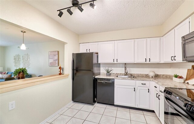 kitchen with white cabinets, black appliances, a textured ceiling, and a sink