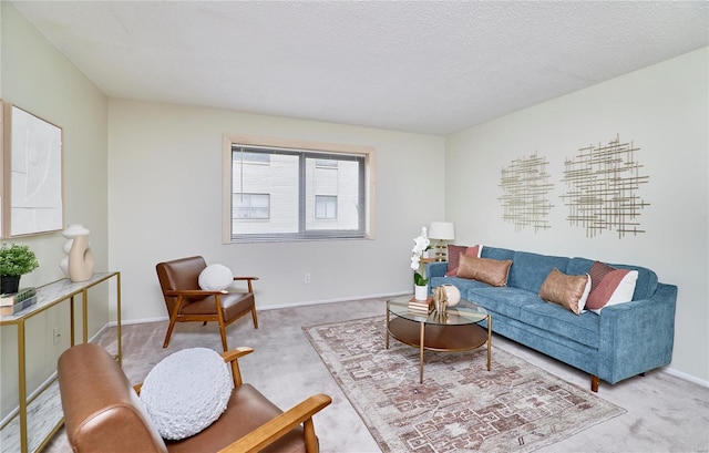 living area featuring carpet, a textured ceiling, and baseboards