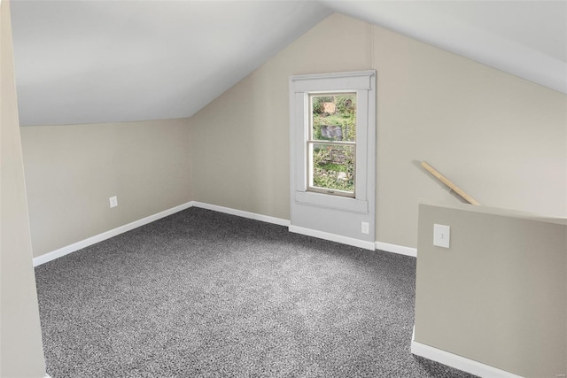 bonus room featuring baseboards, carpet, and vaulted ceiling