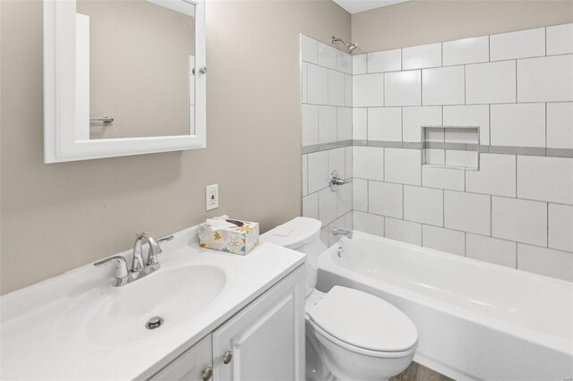 full bathroom featuring toilet, shower / bathtub combination, and vanity