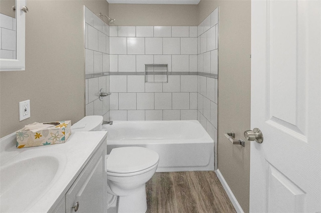 full bathroom with vanity, shower / bathing tub combination, toilet, baseboards, and wood finished floors