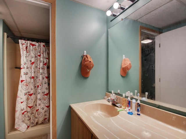 full bath with a shower stall and vanity