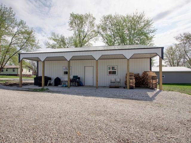view of outbuilding with a carport