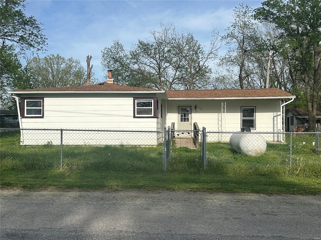 view of front of home featuring fence