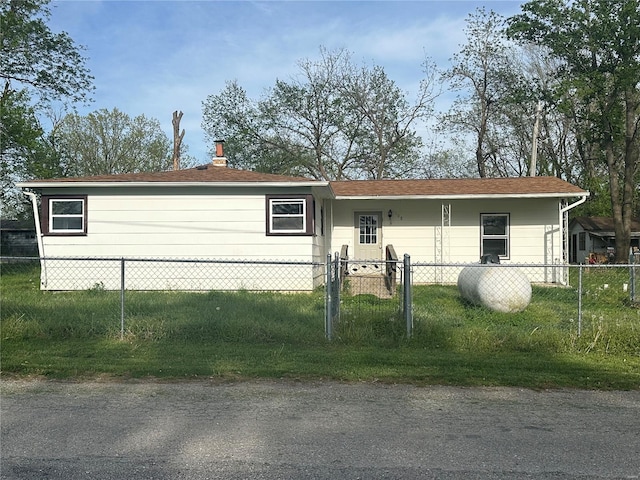 view of front of home featuring fence