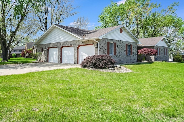 view of front of property featuring an attached garage, brick siding, a front yard, and concrete driveway