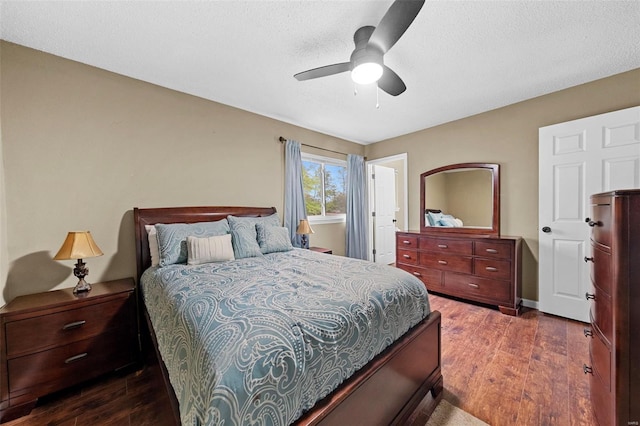 bedroom with a textured ceiling, a ceiling fan, and wood finished floors