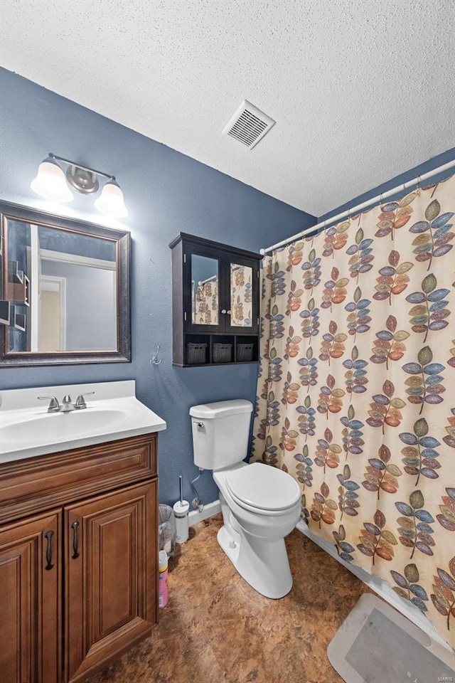 full bathroom with a textured ceiling, visible vents, curtained shower, vanity, and toilet
