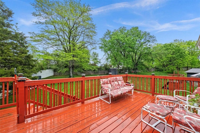 wooden deck featuring a fenced backyard