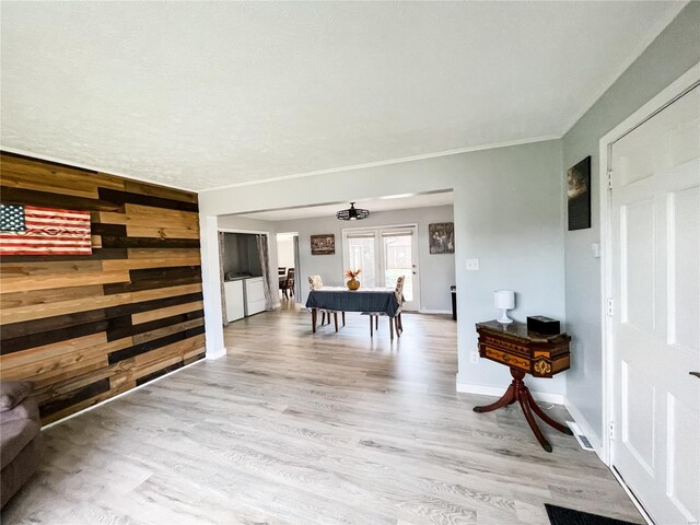 playroom with baseboards and light wood-style floors