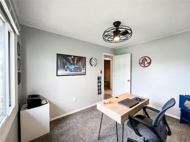 carpeted office space featuring baseboards