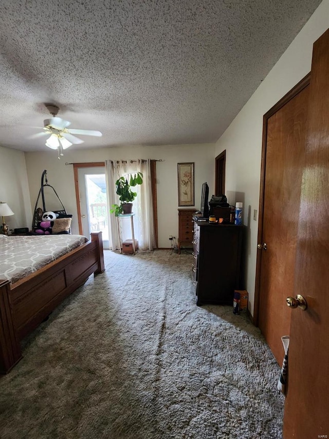 carpeted bedroom with a textured ceiling, a ceiling fan, and access to exterior