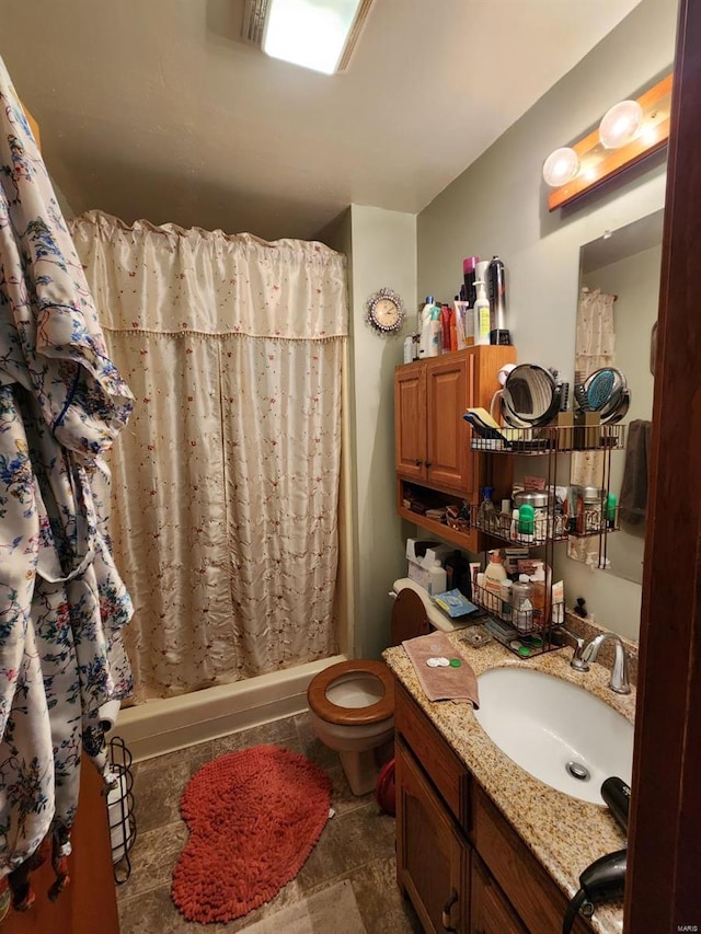 full bathroom with toilet, vanity, and shower / tub combo