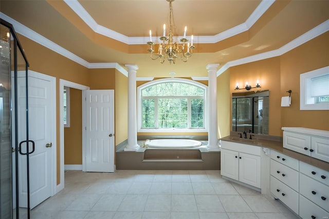 full bath featuring a stall shower, decorative columns, a raised ceiling, and vanity
