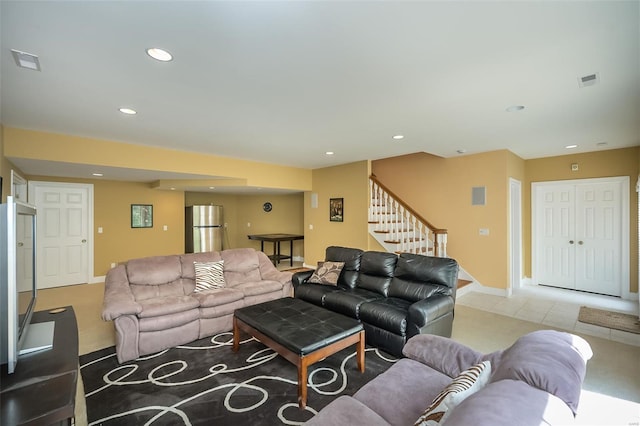tiled living room featuring stairway, visible vents, recessed lighting, and baseboards