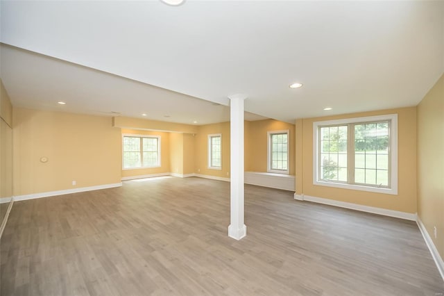 below grade area with baseboards, recessed lighting, and wood finished floors
