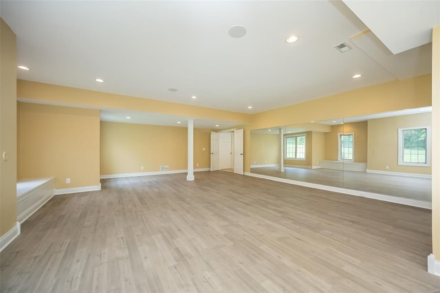 interior space featuring light wood-style floors, recessed lighting, visible vents, and baseboards