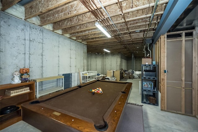 playroom featuring unfinished concrete flooring and pool table