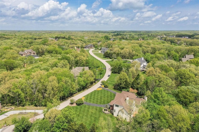 aerial view featuring a wooded view