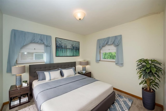 carpeted bedroom with baseboards
