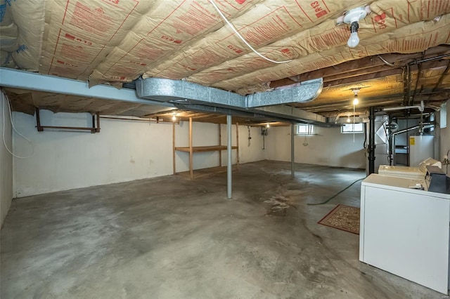 basement with gas water heater and washer / clothes dryer