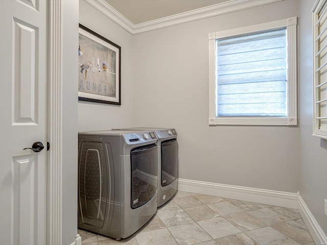 laundry room featuring separate washer and dryer, crown molding, laundry area, and baseboards