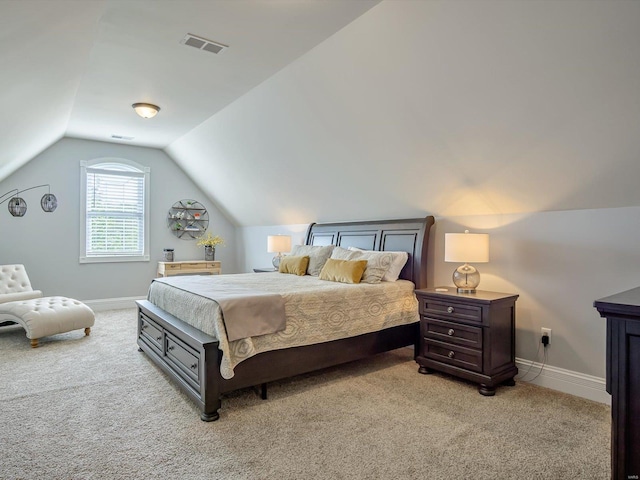 bedroom with baseboards, visible vents, lofted ceiling, and light colored carpet