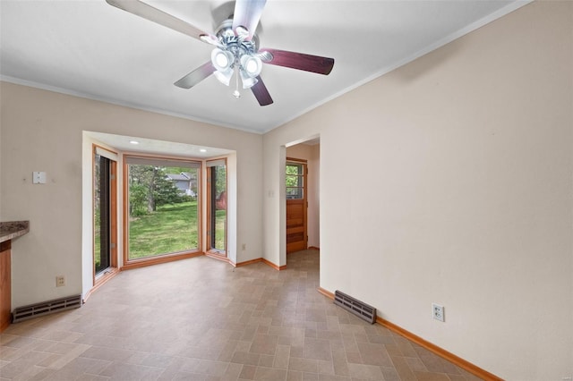 spare room with light floors, visible vents, a ceiling fan, and baseboards