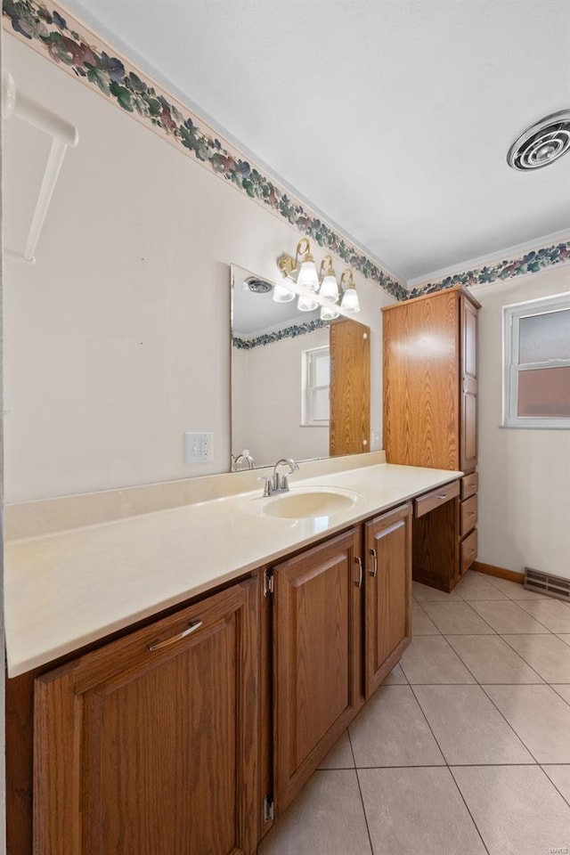 bathroom featuring tile patterned flooring, visible vents, vanity, and baseboards