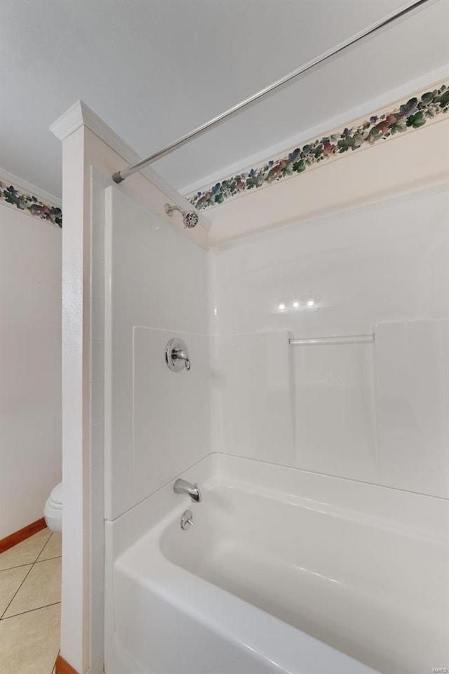 full bath with toilet, tile patterned flooring, and bathtub / shower combination