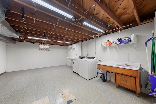 clothes washing area with separate washer and dryer and laundry area