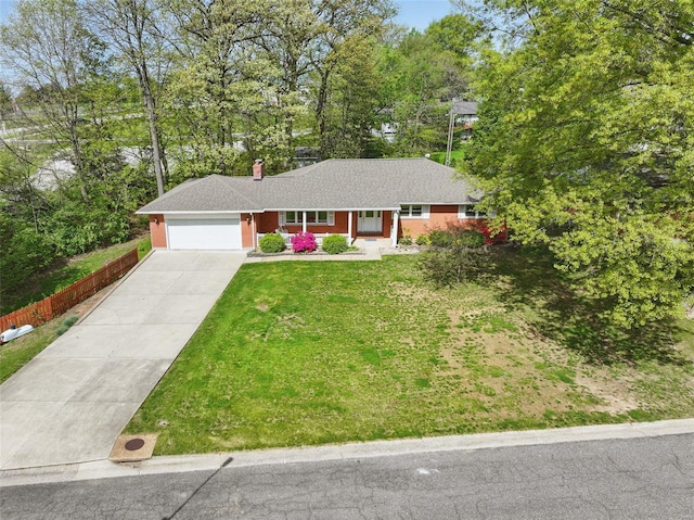 ranch-style house featuring a chimney, covered porch, driveway, a front yard, and an attached garage