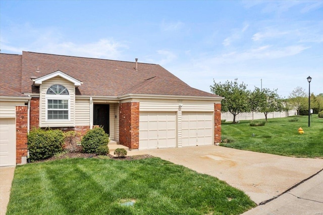 split level home featuring a garage, brick siding, a front lawn, and concrete driveway