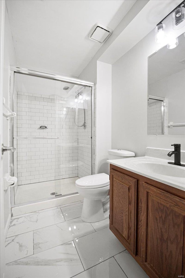 full bath featuring a stall shower, vanity, marble finish floor, toilet, and visible vents