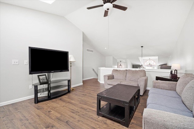living room with a ceiling fan, wood finished floors, baseboards, lofted ceiling, and visible vents