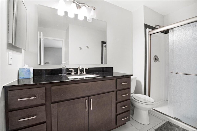 full bath featuring toilet, vanity, and a stall shower