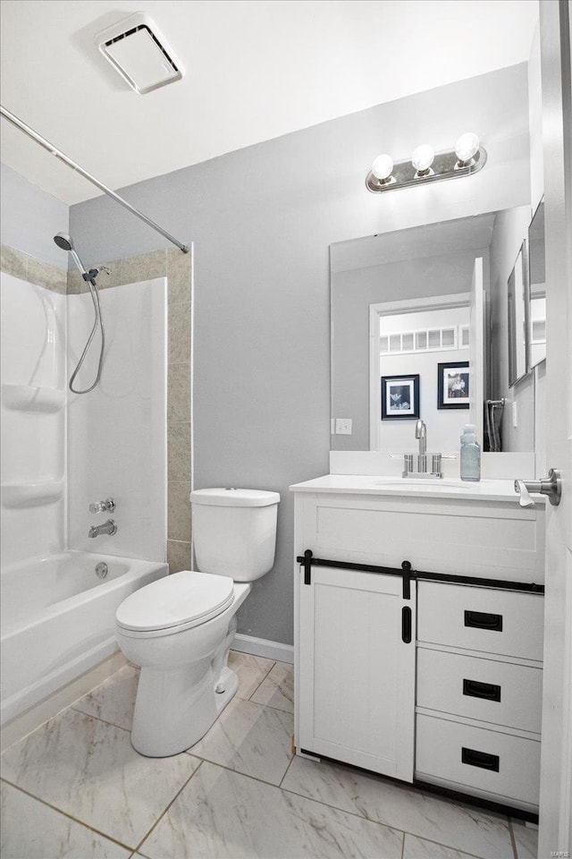 bathroom with marble finish floor, tub / shower combination, vanity, and toilet